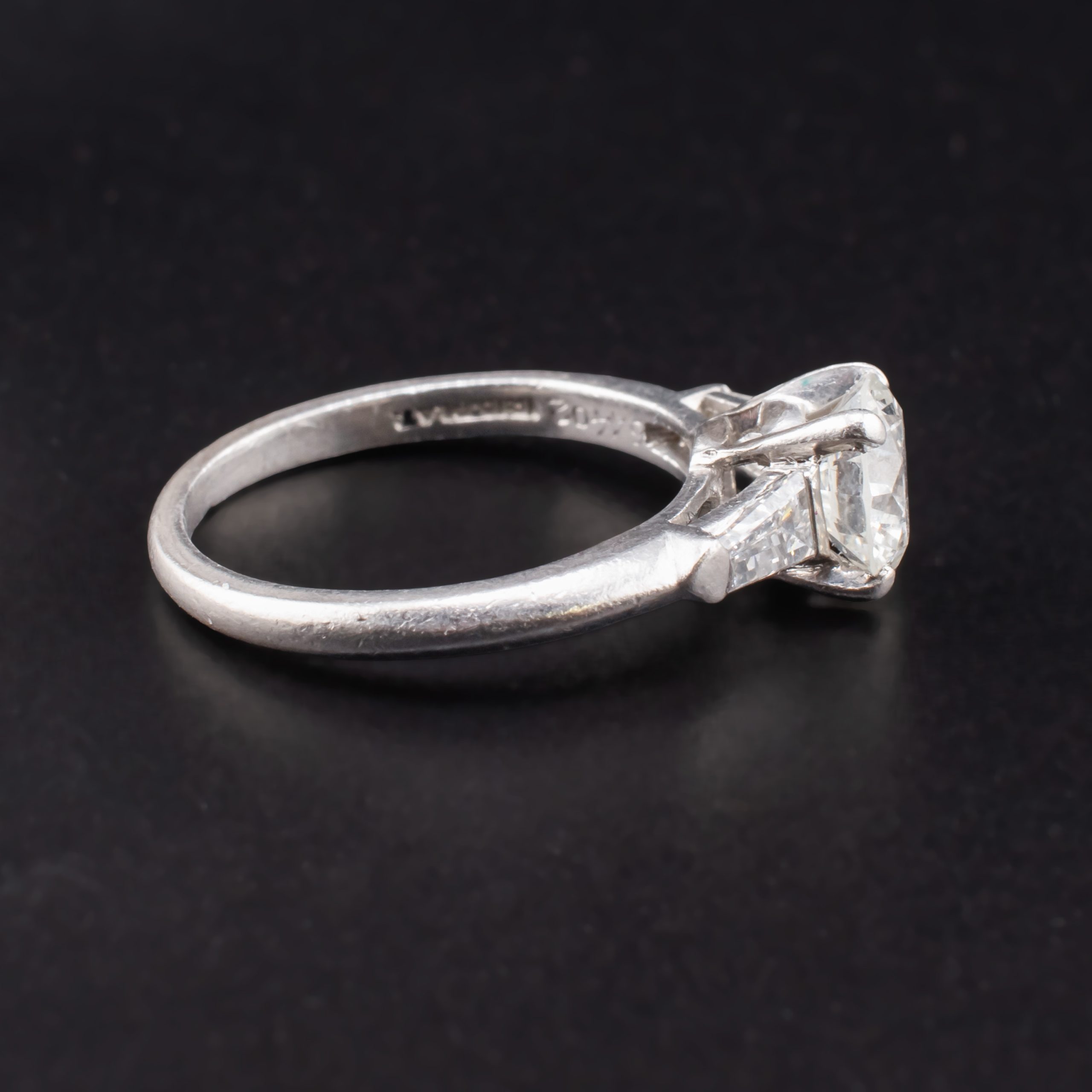 Mid Century Round 0.88 Carat Diamond Solitaire Set in Iridium Platinum with Two Tapered 0.2 Carat Baguette Diamonds attributed to Shreve & Company Jewelers - Image 4