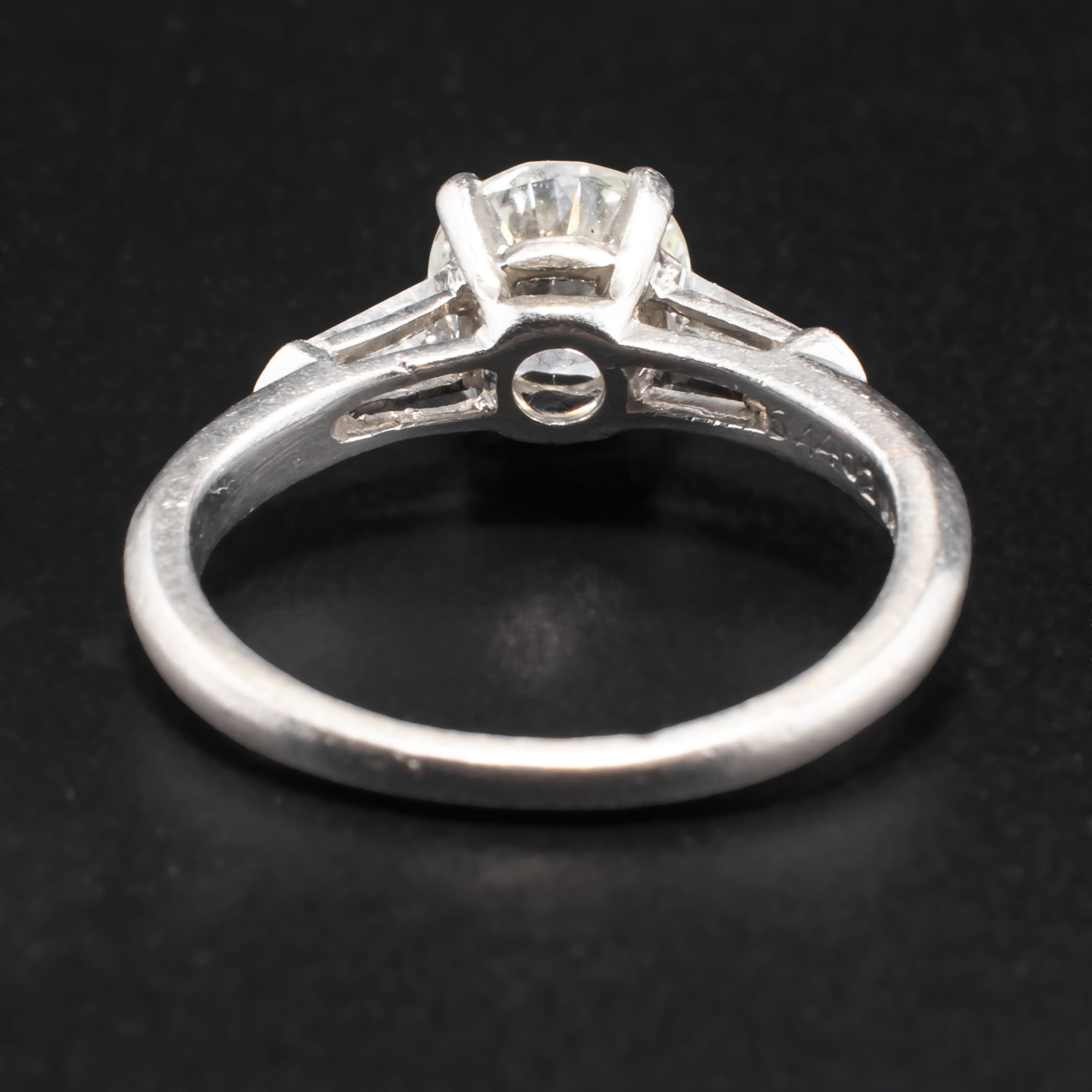 Mid Century Round 0.88 Carat Diamond Solitaire Set in Iridium Platinum with Two Tapered 0.2 Carat Baguette Diamonds attributed to Shreve & Company Jewelers - Image 6
